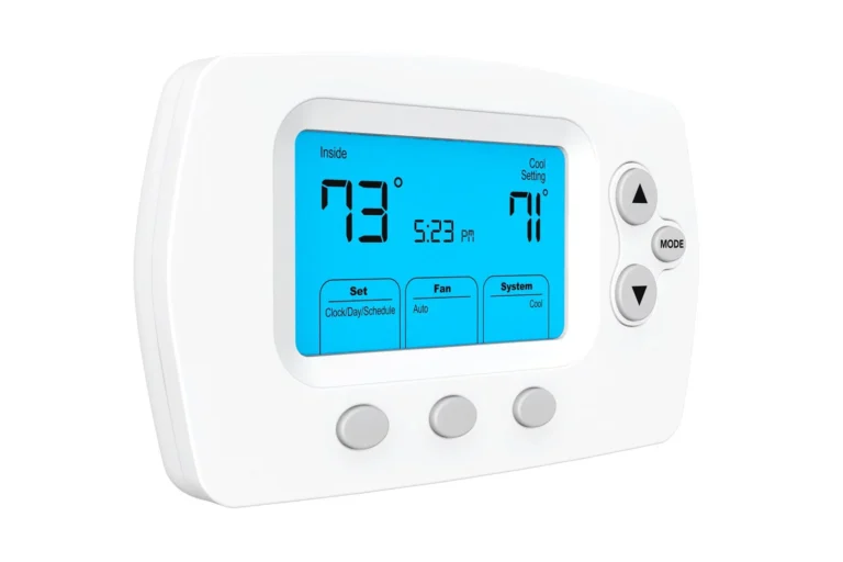 Digital thermostat displaying an indoor temperature of 73 degrees, with a cool setting of 71 degrees, and several control buttons on the front.